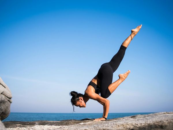 Person demonstrating strength and flexibility in a yoga pose.
