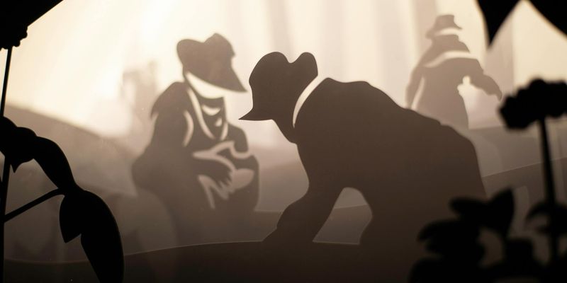 Silhouette of a person meditating against a stylized background.